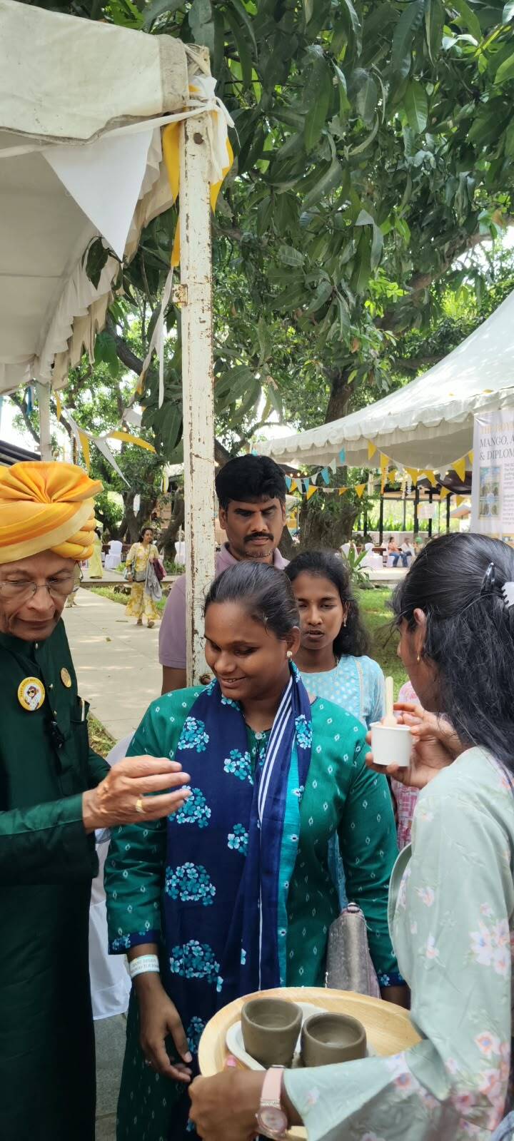 A student of Thaaikarangal Charitable Trust participates in a sensory tasting activity at Hanu Reddy Mango Festival 2026, interacting with festival hosts and exploring traditional food and farm experiences through touch, taste and conversation at Hanu Reddy Raghava Farms, Chennai. A student of Thaaikarangal Charitable Trust participates in a sensory tasting activity at Hanu Reddy Mango Festival 2026, interacting with festival hosts and exploring traditional food and farm experiences through touch, taste and conversation at Hanu Reddy Raghava Farms, Chennai.