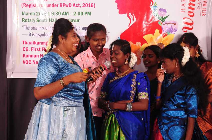 Visually impaired women engaging in a lively group activity on stage during the International Women’s Day Celebration 2026, showcasing confidence, joy, and empowerment Visually impaired women engaging in a lively group activity on stage during the International Women’s Day Celebration 2026, showcasing confidence, joy, and empowerment