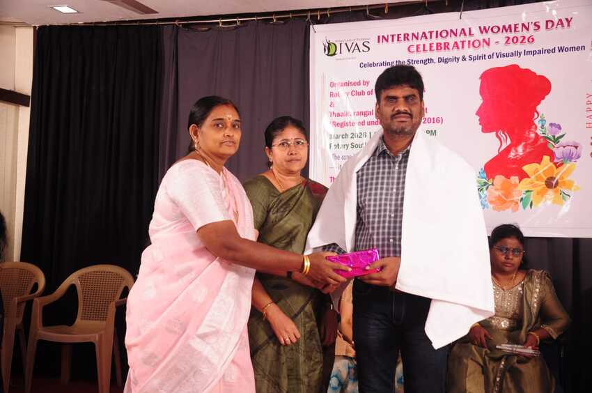 Guest being honoured with a shawl and gift during the International Women’s Day Celebration 2026 in Thanjavur, recognising support for empowering visually impaired women and promoting inclusion Guest being honoured with a shawl and gift during the International Women’s Day Celebration 2026 in Thanjavur, recognising support for empowering visually impaired women and promoting inclusion