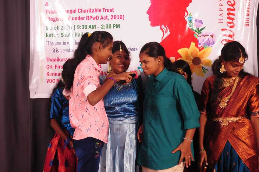 Visually impaired participants engaging in a fun on-stage interaction with a microphone during the International Women’s Day Celebration 2026, highlighting confidence, participation, and inclusion. Visually impaired participants engaging in a fun on-stage interaction with a microphone during the International Women’s Day Celebration 2026, highlighting confidence, participation, and inclusion.