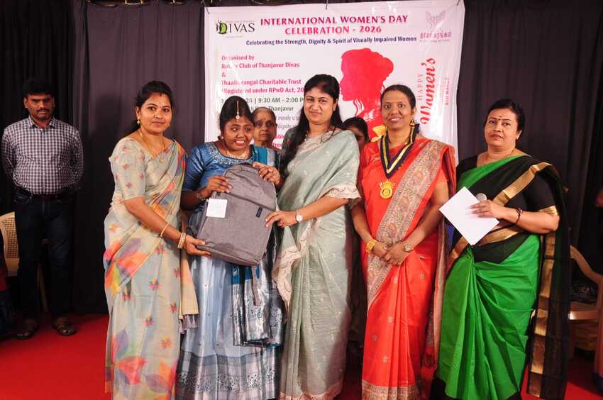 Visually impaired student receiving a backpack from organisers during the International Women’s Day Celebration 2026 in Thanjavur, organised by Thaaikarangal Charitable Trust with Rotary Club of Thanjavur Divas Visually impaired student receiving a backpack from organisers during the International Women’s Day Celebration 2026 in Thanjavur, organised by Thaaikarangal Charitable Trust with Rotary Club of Thanjavur Divas
