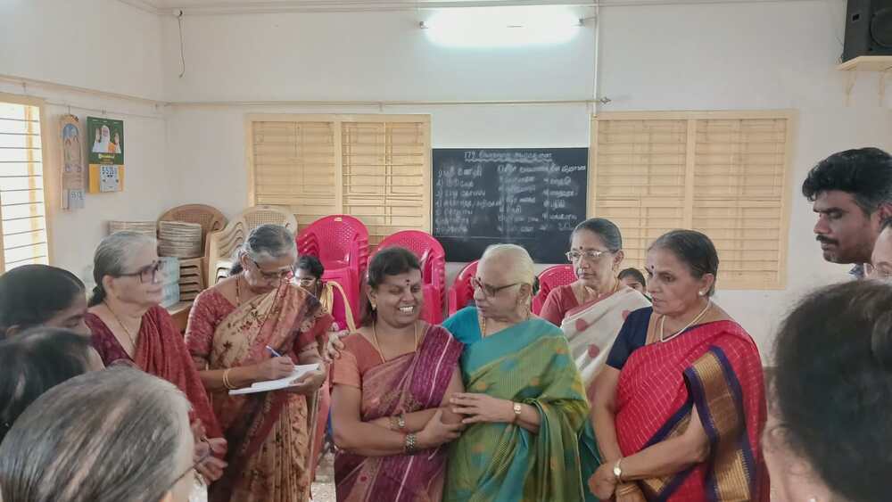 Participants and organizers gather during the 10-day Residential Sewing Training Camp conducted by Darshini in collaboration with Thaaikarangal Charitable Trust at the Indira Nagar Women’s Association Hall. The photograph shows visually impaired women, trainers, and supporters standing together in a community hall, sharing a joyful and encouraging moment. The image reflects the spirit of empowerment, collaboration, and confidence fostered through the tailoring programme, which equipped visually impaired women with practical sewing skills for sustainable livelihoods and financial independence. Participants and organizers gather during the 10-day Residential Sewing Training Camp conducted by Darshini in collaboration with Thaaikarangal Charitable Trust at the Indira Nagar Women’s Association Hall. The photograph shows visually impaired women, trainers, and supporters standing together in a community hall, sharing a joyful and encouraging moment. The image reflects the spirit of empowerment, collaboration, and confidence fostered through the tailoring programme, which equipped visually impaired women with practical sewing skills for sustainable livelihoods and financial independence.