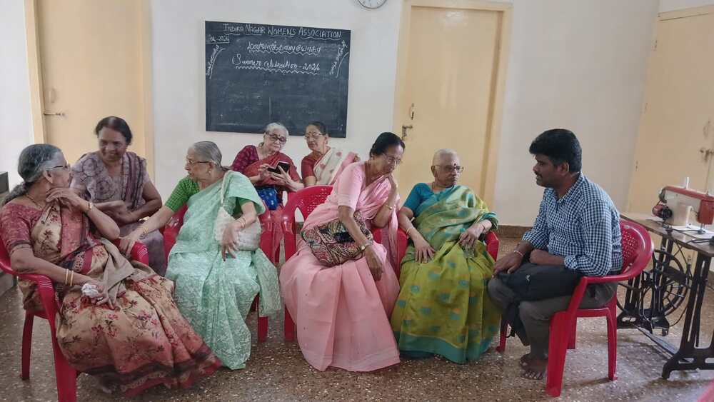 Organizers and supporters interact during the residential sewing training camp, highlighting the community support behind the empowerment of visually impaired women. Organizers and supporters interact during the residential sewing training camp, highlighting the community support behind the empowerment of visually impaired women.